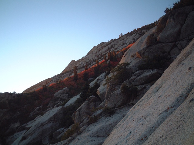The last rays of the sun light up a string of red scrub-oak up by the thumb.