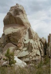 O-Town Spire.  I made the FA of this formation on the May 11th via the slab on the right skyline.  We added two more routes, a nice bolted 10a that climbs to the right of the overhangs in the center of the photo, and a trad route up the crack splitting the overhangs on the left side of the photo.