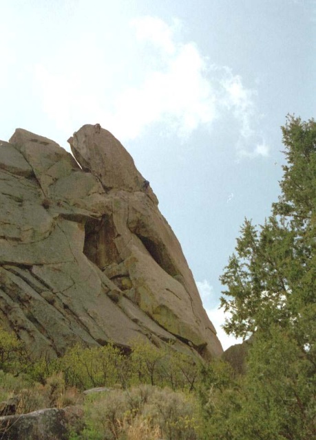 Looking South at the West Summit of Castle Rock, aka Lone Rock.  "Excalibur" climbs out the right side of the central cave, then goes up the bulletproof arete to the summit.