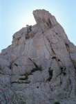Rob at the top of the 3rd pitch.  The crux pitch is above him, climbing up to and around the protruding left facing dihedral.