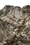 There is a leftward diagonaling crack just under the face to an arete that keeps the grade at about 5.9