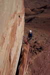 Rap to the ground with a 60 from here.  A 70m takes away another rap at the top and allows 3 total to the ground.  Check out that flake - its the right edge of the flake you belay the Traverse pitch from.